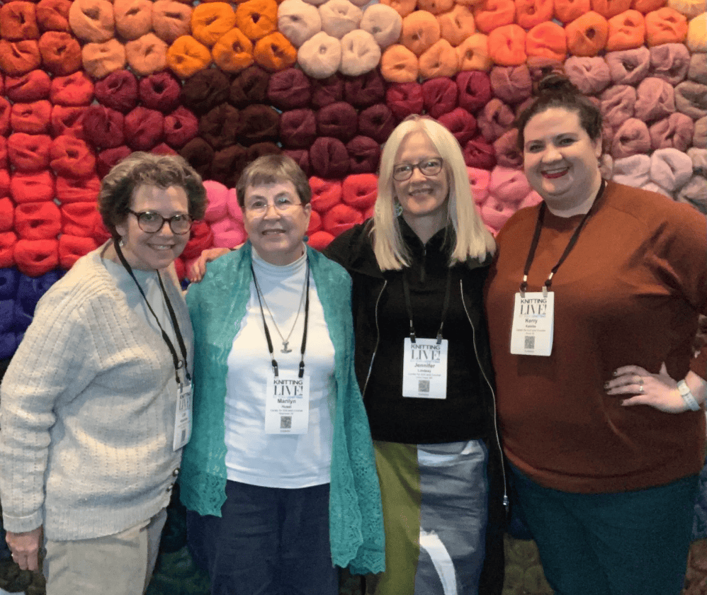 L-R: Lori Winterfeldt, Marilyn Huset (Treasurer), Jennifer Lindsay (President), Kerry Kaleba, at Vogue Knitting Live, February 2023.